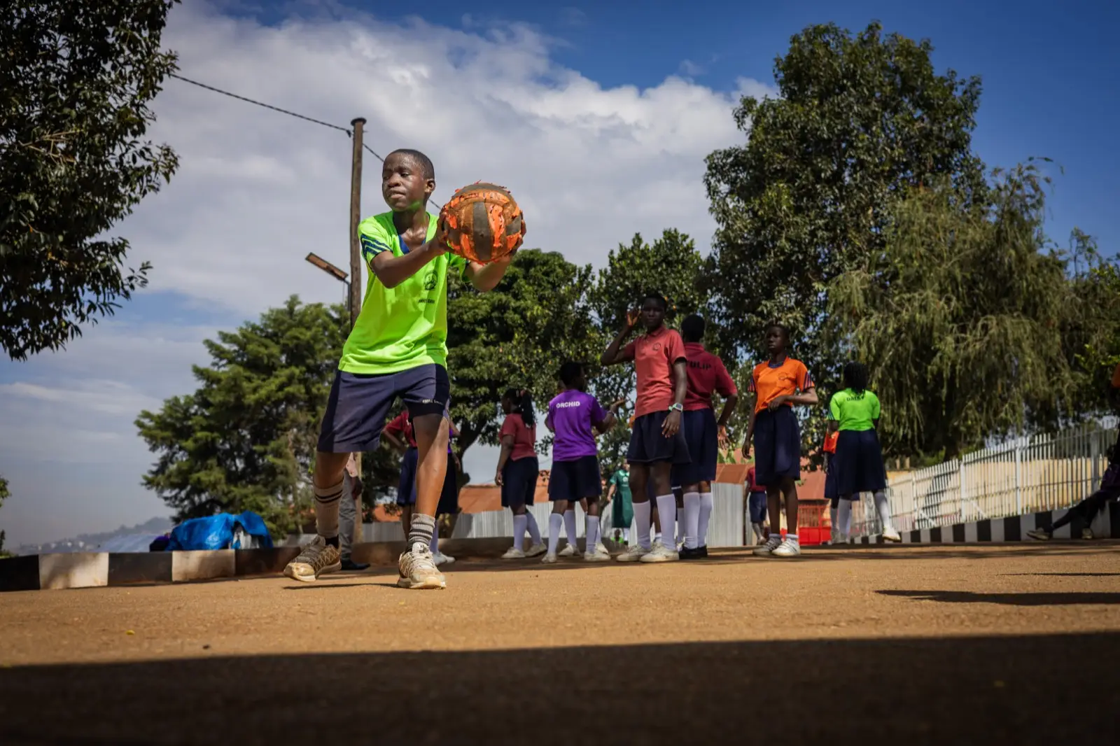 Learners playing basketball