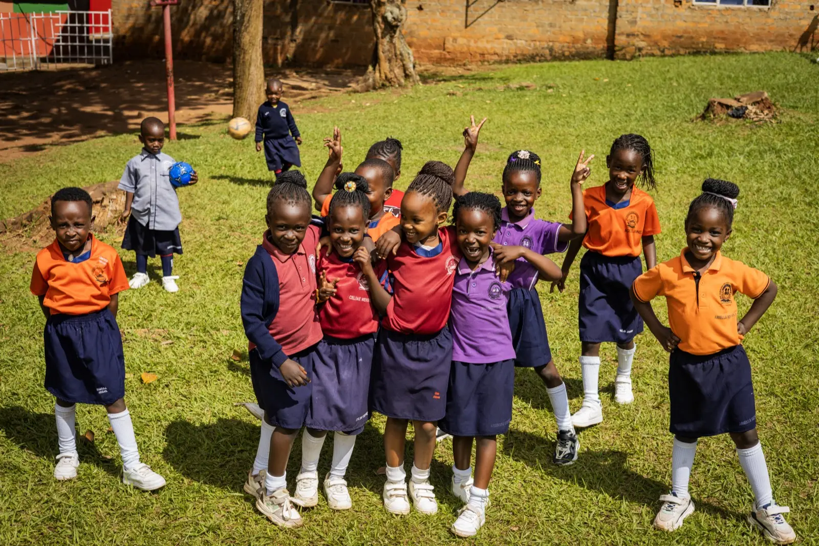 Learners cheering together on the school field