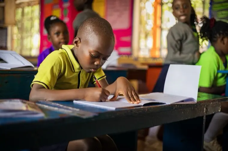 A learner concentrating on his work