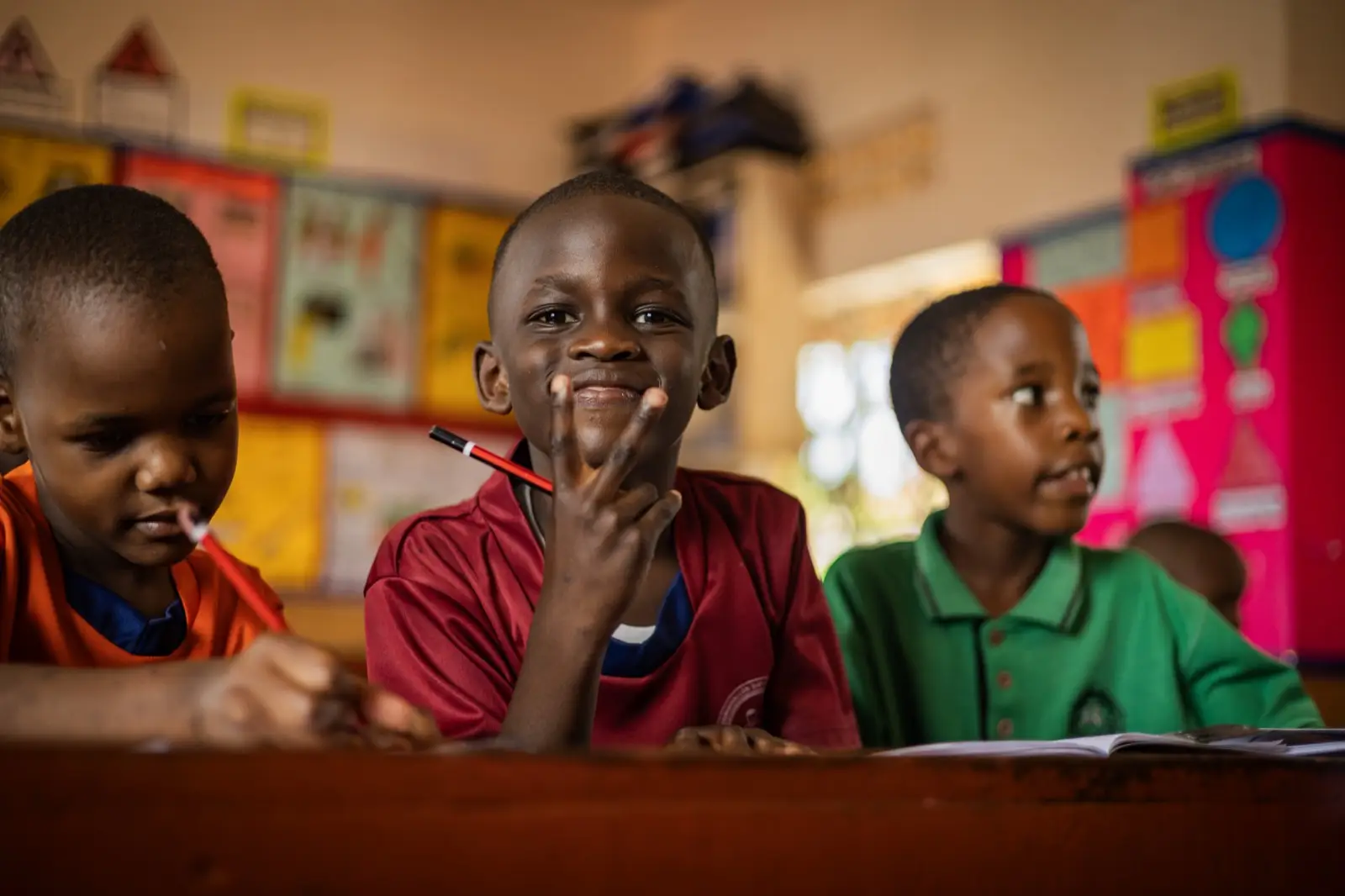 Smiling learners at their desks