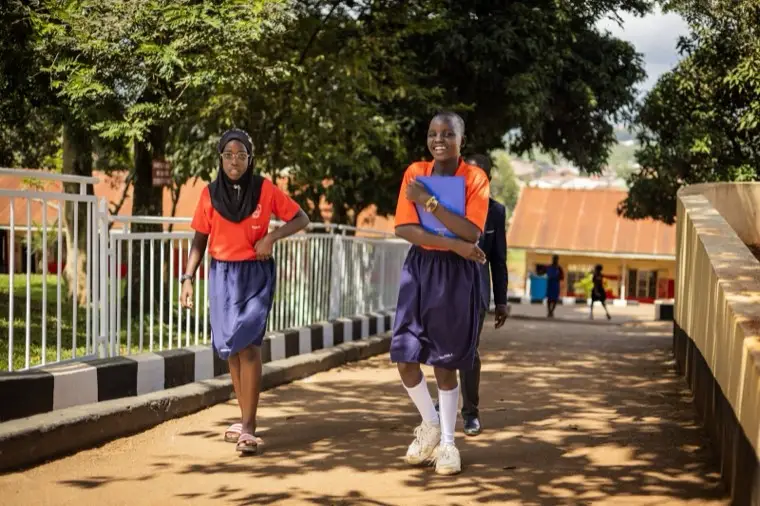 Learners walking along the campus path